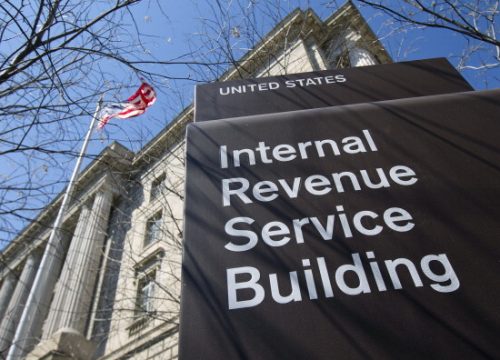 1508777230_tax pic The Internal Revenue Service (IRS) building stands in Washington, D.C., U.S., on Wednesday, April 6, 2011. The IRS would have to suspend tax audits, the Small Business Administration's processing of loan applications would be halted and National Parks would close if the federal government is forced into a partial shutdown because of the budget impasse in Congress. Photographer: Bloomberg/Bloomberg